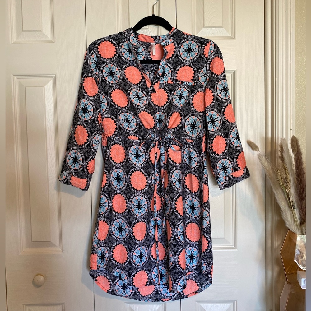 Long sleeve short dress. Has a waist string to tighten in the waist area